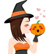 © Kakigori Studio - Beautiful young brunette witch kissing pumpkin on Halloween