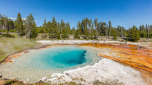 Bright Colors Of Hot Springs. Incredible Blue Lake. The Reds, Yellows And Browns Of The Mud In Fountain Paint Pots. Yellowstone National Park, Wyoming