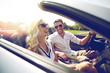 © Syda Productions - happy man and woman driving in cabriolet car