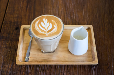 Wall Mural - Hot Piccolo latte coffee serve with syrup on wooden tray