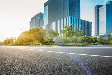 Poster - city empty traffic road with cityscape in background