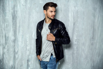 Wall Mural - Photo of handsome man in black leather jacket