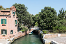 Canal And Traditional Buildings In Giardini In Venice, Italy 