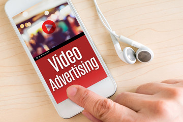Poster - Hand touch smart phone and ear phone with Video Advertising word