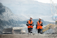 Workers With Coal At Open Pit