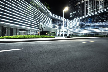 Wall Mural - city empty traffic road with cityscape in background