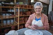© WavebreakMediaMicro - Female potter smiling in pottery workshop