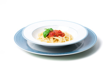 Wall Mural - Original Italian Spaghetti with fresh tomato sauce and fresh basil. White wood table background.