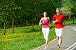 © Kadmy - Young man and woman jogging outdoors