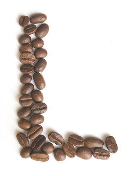 Letter L made of coffee beans under a daylight isolated on white background