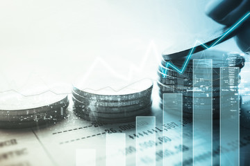 Double exposure of graph and rows of coins for finance and banking concept

