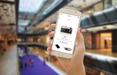 Poster - Shopping in city mall with smart phone app. Mobile in woman hand.