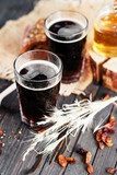 Fototapeta  - 
summer and autumn cooling drink , kvass or  dark beer with honey , raisins and rye bread on a wooden background