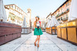 © rh2010 - Young female tourist standing on the central market square in Verona town.