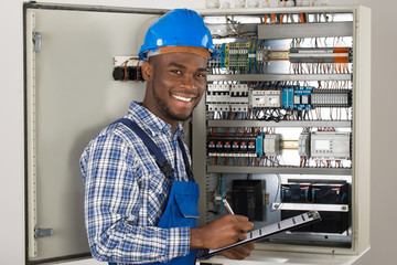 Male Technician Holding Clipboard