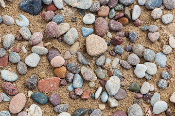 Pebble on the sand after rain. Top view, beach