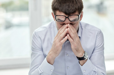 Sticker - tired businessman with eyeglasses in office