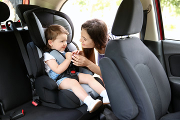 Mother and child in car. Safety driving concept