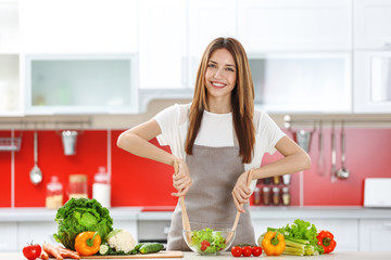 Wall Mural - Woman cooking  healthy food in the kitchen