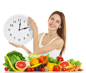 Wall Mural - Woman with clock and healthy food on white background