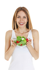 Wall Mural - Woman holding a bowl of salad on white background