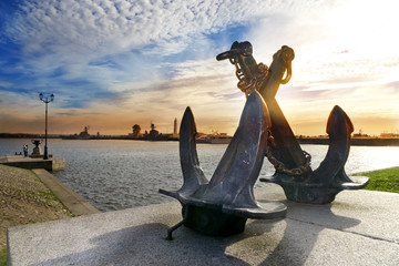 silhouette of old sea crossed anchors on the background of Peter's harbour. Kronstadt, St. Petersburg, Russia