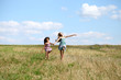 © Andrey_Arkusha - Two little girls running in summer field
