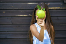 Picture Of Beautiful Girl With Green Apple