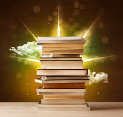 Wall Mural - Magical books with ray of magical lights and colorful clouds