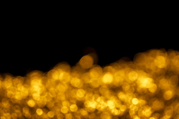 Wall Mural - Gold bokeh on black background