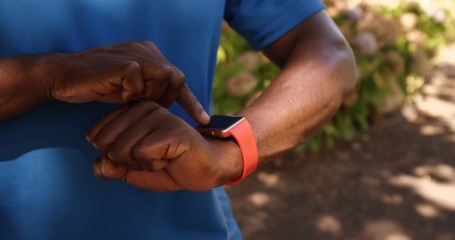 Poster - Close up of man is using a smart watch 