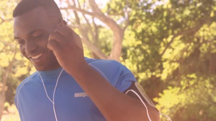 Poster - Sportsman is running with music in the park 