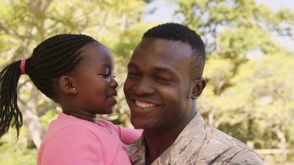 Poster - American soldier is embracing his daughter 
