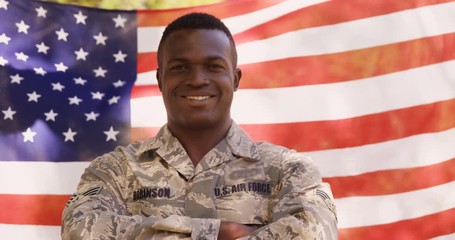 Poster - Soldier is smiling to the camera with crossed arms 
