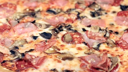 Wall Mural - freshly baked meat pizza. shot rotation