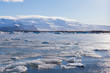 Beautiful ice melt on the lagoon with mountain background, Iceland winter natural landscape