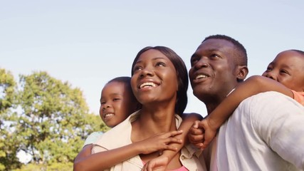 Poster - Family smiling and pointing away 