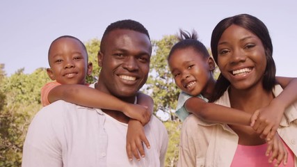 Poster - Couple carrying their children on their back