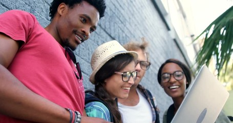 Poster - Young hipsters are looking a laptop 
