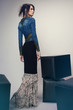 © EVGENY FREEONE - Woman in denim jacket and long dress
