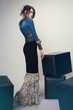 © EVGENY FREEONE - Woman in denim jacket and long dress