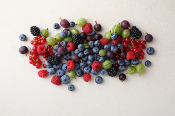 Wall Mural - Fresh summer berries on concrete background