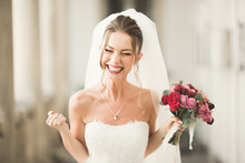 Luxury Wedding Bride, Girl Posing And Smiling With Bouquet