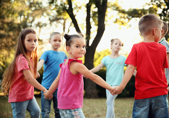 Wall Mural - Group of playful kids in park