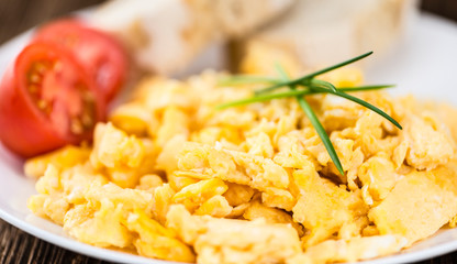 Wall Mural - Plate with scrambled Eggs (close-up shot)