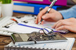 © vizafoto - Hands close-up at the office in the composition of objects for business