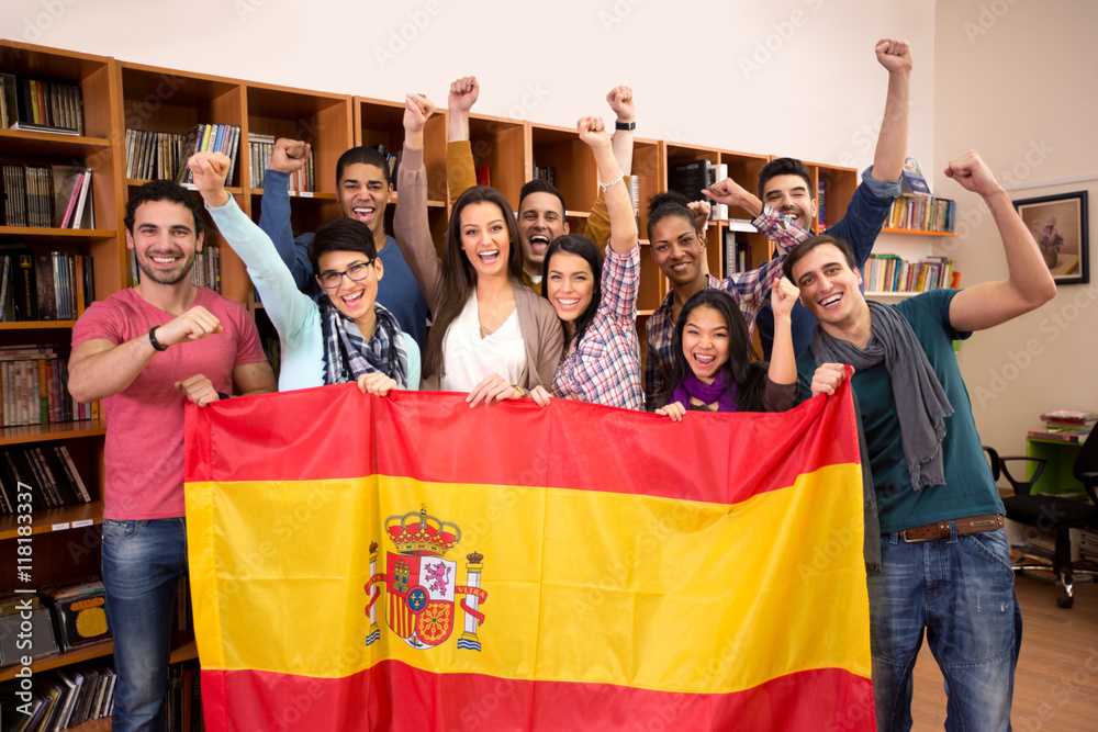 Team of excited Spanish students with victory smile - obrazy, fototapety, plakaty 