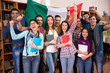 © luckybusiness - Happy students smiling and presenting Italian country with flag