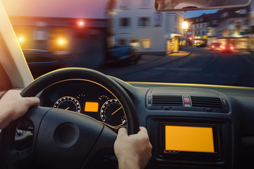 Wall Mural - Man driving the car in the evening