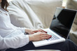 © basin_stock - Close-up of hands typing on laptop keyboard in the home office